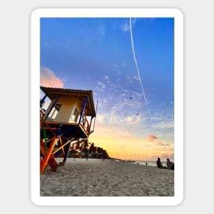 A sun-drenched beach with a crystal-clear ocean stretching out to the horizon. Sticker